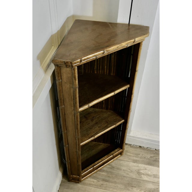 Victorian Bamboo Corner Unit with open shelves This is a floor standing open shelf, the front is decorted with simulated...
