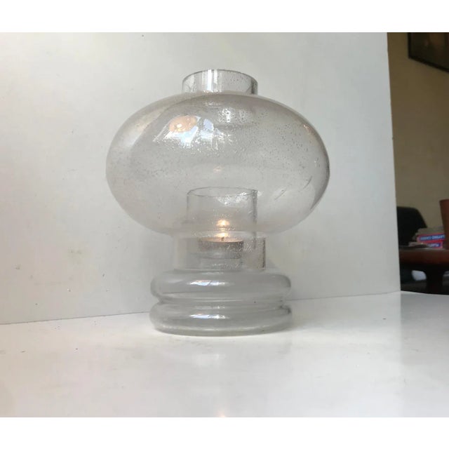 Spacey looking candle table lamp for tea light, bloc or ball candles. It has a base of clear handblown glass and a shade...
