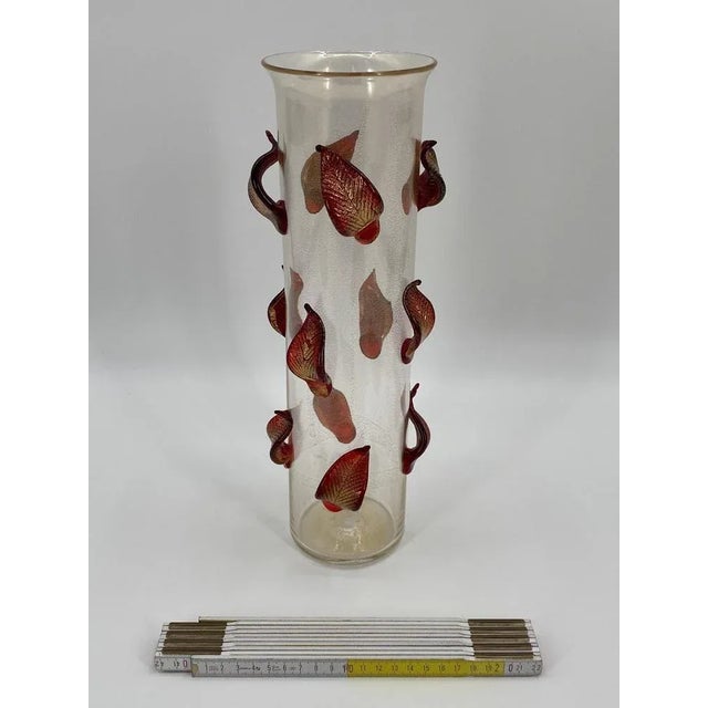 a vase of flowers *Vase "Foglie" *by Cleto Munari *from the "Cromatic Transparencies" series *Limited to 80 copies *This...