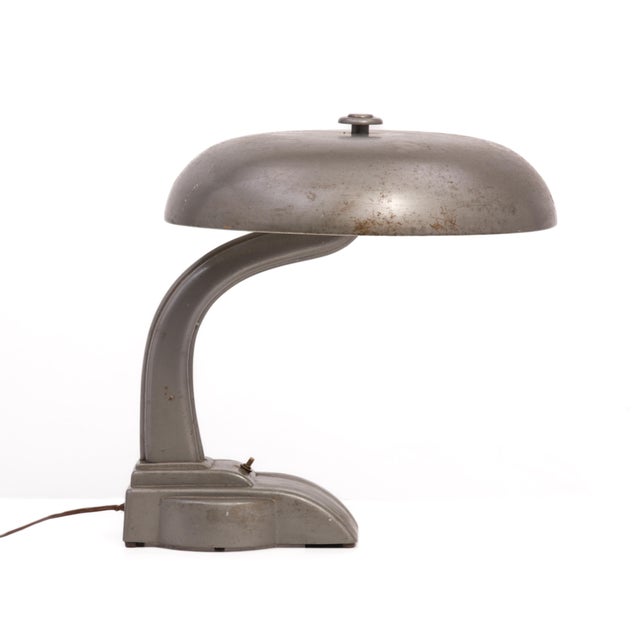 A substantial "flying saucer" desk lamp by Art Specialty Co., Flexo from the 19450s. Unmarked, the bottom plate matches...