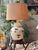 Hollywood Regency meets Chinoiserie with this ginger jar shaped lamp on attached rattan base, accented with hand painted...