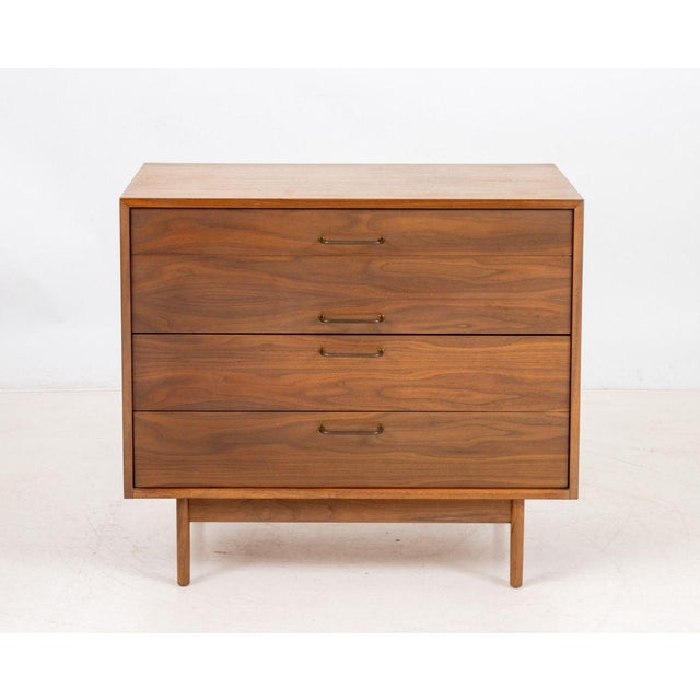 Jens Risom Walnut Chest of Drawers, with three frieze drawers on four tapered legs, "Jens Risom Design, Inc." label to...
