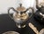 A Chinese export sterling silver tea set comprised of 13 pieces including tea pot, sugar, creamer, four tea bowls and six...