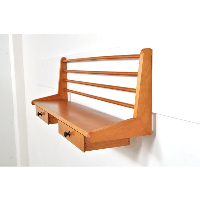 Wall-mounted beechwood unit with a shelf and two drawers. add character and minimalist design to your interior with this...