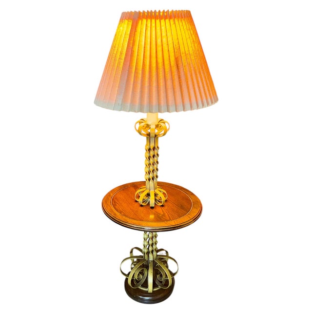 An exquisite vintage Mid-Century Modern floor lamp and integrated accent table crafted in the Florentine / Spanish Revival...