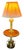 An exquisite vintage Mid-Century Modern floor lamp and integrated accent table crafted in the Florentine / Spanish Revival...