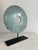 Modern and sleek, this polished marble disc in a soothing green will add height in a room for your eye to travel. Last...