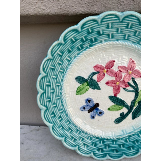 French majolica plate with flowers & butterfly, Circa 1900.