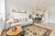 A hand-knotted wool rug in a traditional allover floral design, made in India and measuring 8' x 10'. The drawing repeats...