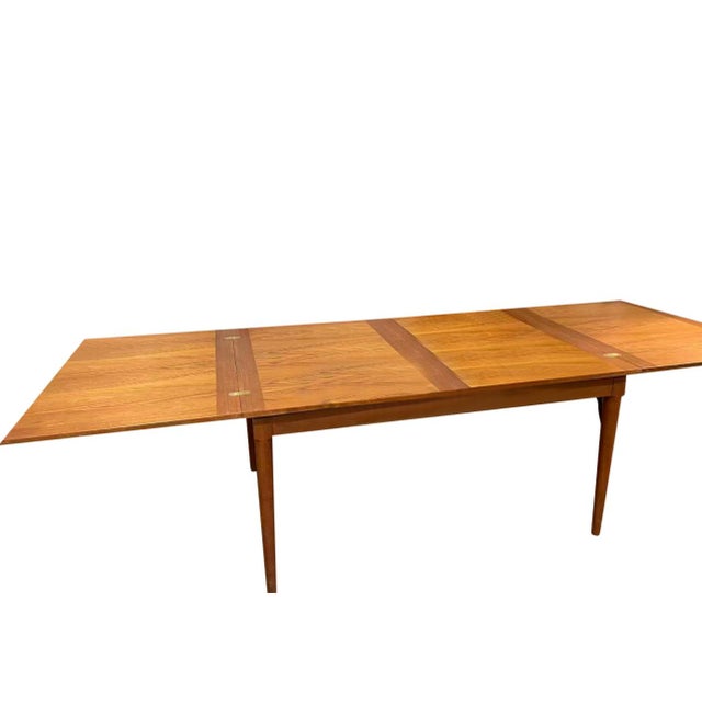 Nice danish teak flip top dining table. Great space saver when closed 56" when fully open measures 112" long to fit your...