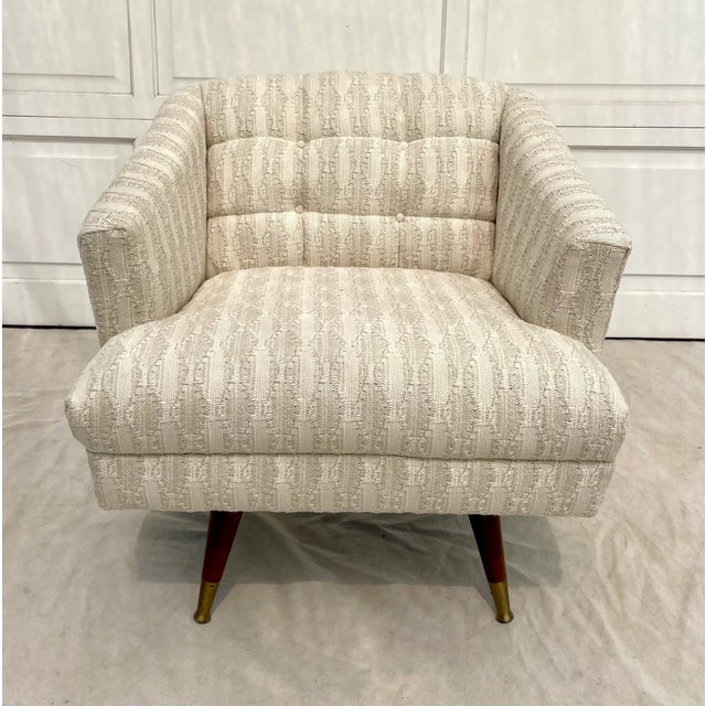 Here is a fabulous armchair from the mid-century that has been given a new life with a beautiful, textural woven...