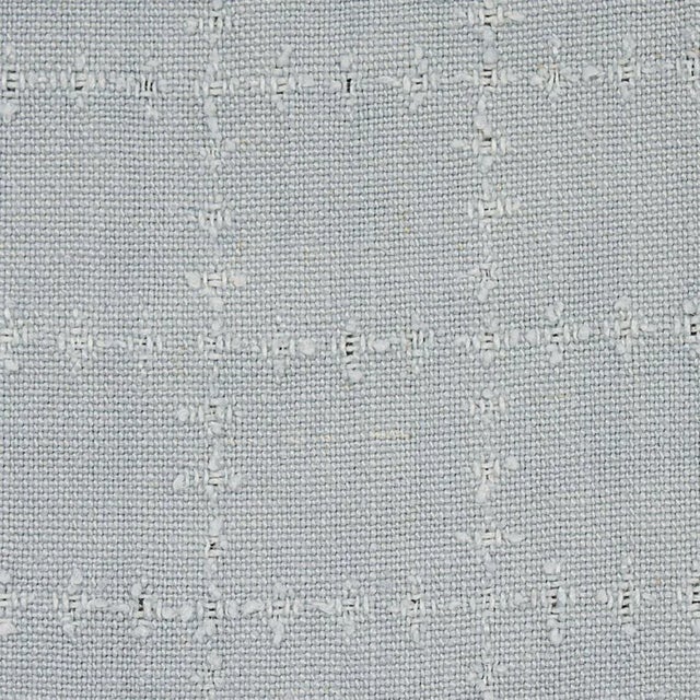 The subtle pattern Elin Check is the result of a unique finishing process where the linen fabric is perforated and then...