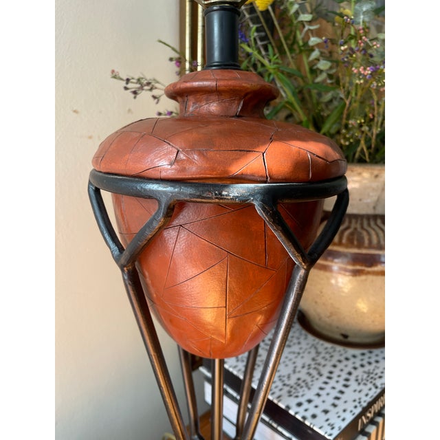Wonderful 1980s lamp by Frederick Cooper, it is a faux leather that is made to look like it is aged and distress, and has...