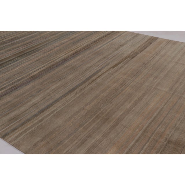 Hand-knotted in wool, this monumental 10x15 rug is a rich new addition to Rug & Kilim’s Textural rug collection, featuring...