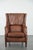 We are offering this very comfortable and luxurious cognac brown cowhide leather armchair with decorative nailhead trim....