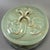 Classic Chinese celadon lidded jar, fitted with matching lid featuring twisted‑loop finial. The body and lid are decorated...