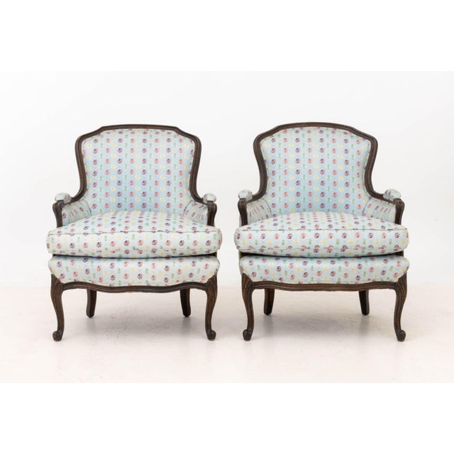 Pair of Louis XV Style Blue Floral Print Fabric Upholstered Bergeres. 35" H x 28" W x 27" D; seat: 19" H. Provenance: From...