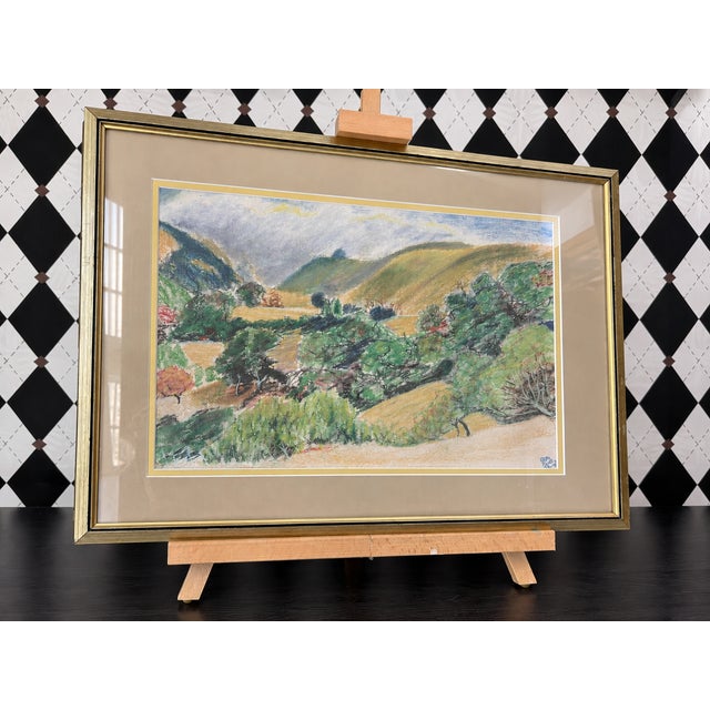 Original colored pencil landscape drawing depicting rolling golden hills, a lush green valley, and layered trees beneath a...