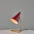 1950s Giuseppe Ostuni Red Conical Table Lamp for Oluce A sculptural design executed in enameled red metal and brass. Shade...