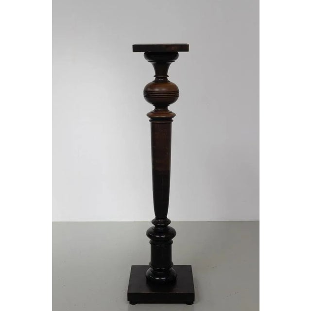 Danish Antique Wooden Pedestal Column, 1910s. Tall and elegant early 1900s wood pedestal in stained black/dark brown...