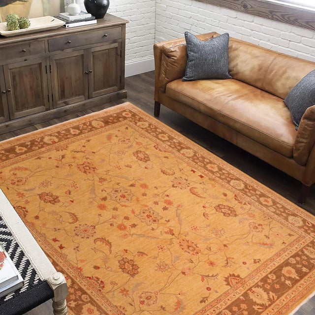 "Enhance the ambiance of your home with this magnificent Persian-influenced Turkish hand-knotted rug made by skilled...