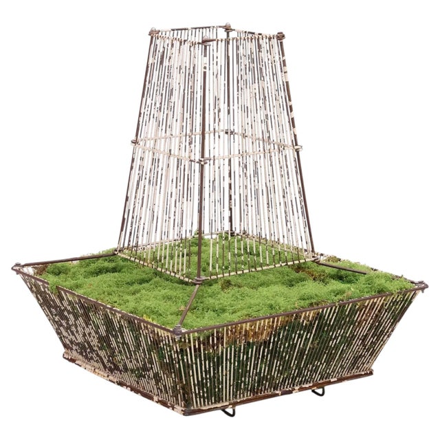 A large French painted iron wirework fernery jardinière featuring a distinctive tiered cloche-form superstructure....
