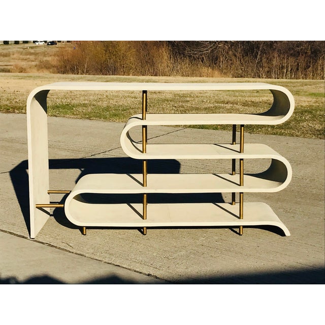 This show stopping console table is sure to wow your guests. Shagreen console table features four curved ribbon style...