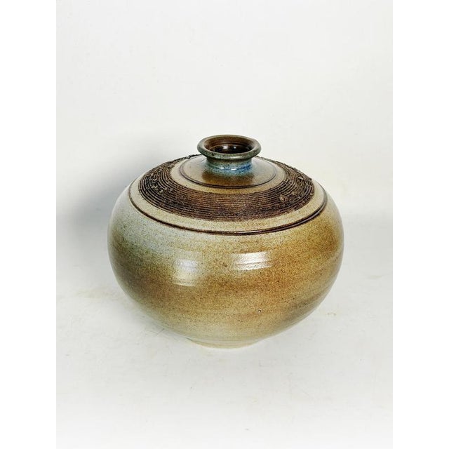 Stoneware vase, France, 1970s, with an organic and balanced design characteristic of handcrafted pieces from this period....