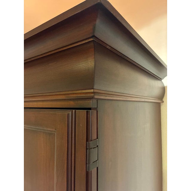 This lovely Computer Armoire Desk is constructed with Cherry Solids and Veneers. It is finished in an antique cherry stain...