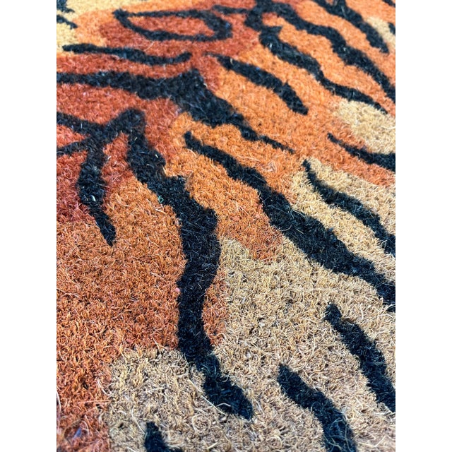 A fun organic animal shaped natural coir fiber doormat with colored tiger style design.