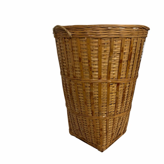 Offering this vintage woven bamboo tortoise, scorched bamboo basket. These tall, tapered baskets are highly versatile and...