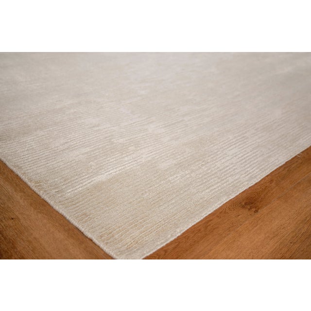 The Soft Lines rug features a soft, plush pile with loop accents in a random multi directional line pattern. Each...