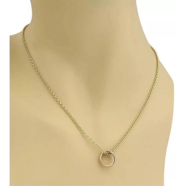 This authentic necklace is by Cartier from the TRINITY collection, the sturdy strand rolo link chain is crafted from solid...