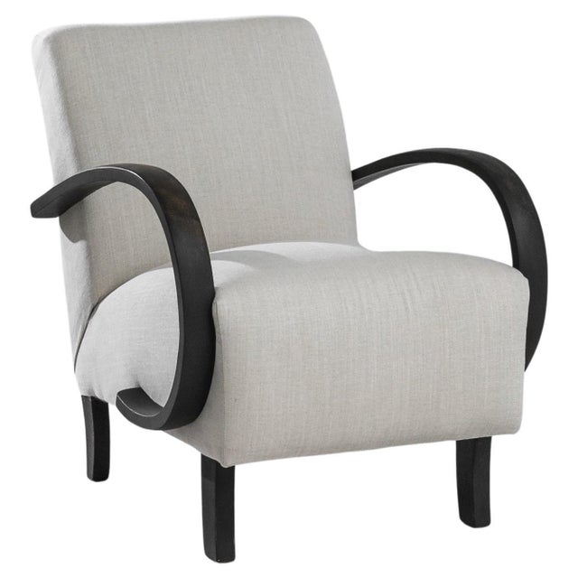 This 1930s Czech armchair, designed by the renowned J. Halabala, is a masterpiece of vintage design that combines...