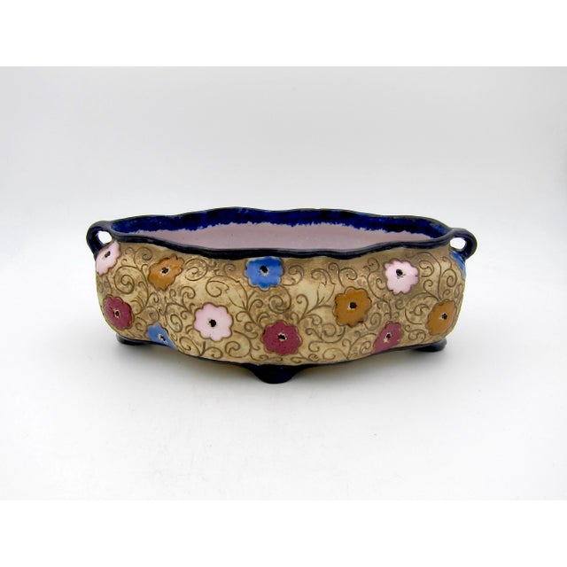 A turn of the 20th century Amphora art pottery cachepot, planter, or jardinière, manufactured by Riessner, Stellmacher &...