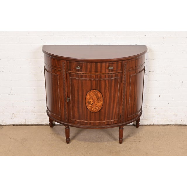 An exceptional French Regency Louis XVI style demilune cabinet or console table By Imperial Furniture of Grand Rapids USA,...