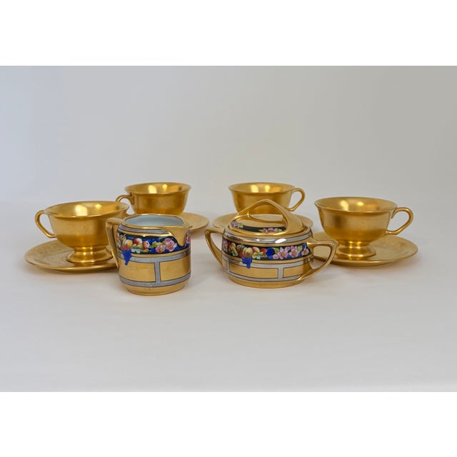 A striking assembled Pickard porcelain tea service set, pairing four American-made Pattern 689 Rose and Daisy footed cups...