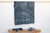 A masterwork of Malian textile heritage featuring deep indigo saturation and symbolic geometric motifs. Originating from...