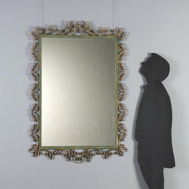 Wall mirror dating back to the 1980s, featuring an enameled wrought iron frame. The sturdy, handcrafted structure is...
