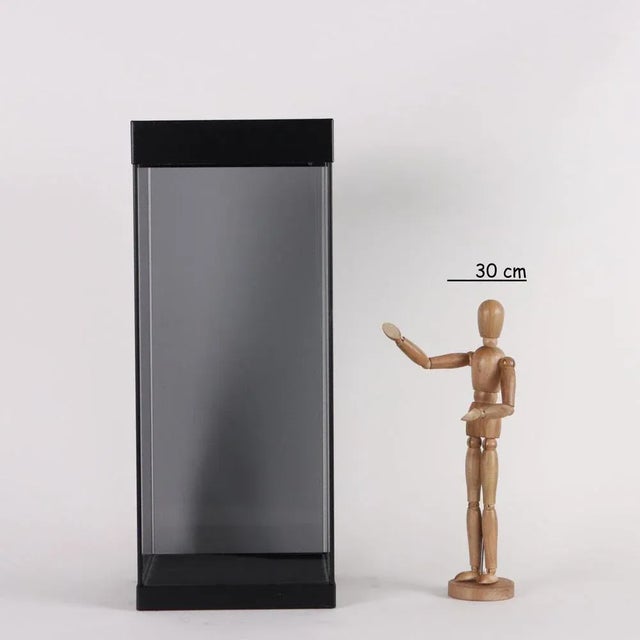 Smoked glass umbrella stand with black patina iron edges. Removable plastic drain tray. Manufacturer's mark under the...