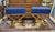 Find pair of X-base stools or bedside benches in lacquered brass and royal blue velveteen upholstery. Each measures 20 in...