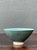 This vintage handcrafted ceramic bowl exemplifies the understated beauty of studio pottery through its elegant form and...