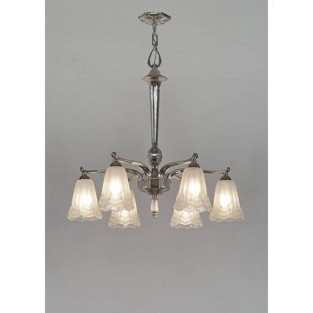 Degué A large 1930 French art deco chandelier in nickel plated bronze or solid brass holding six shades in clear frosted...