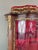 An elegant louis xv style display cabinet dating from the 19th century, crafted from marquetry wood and adorned with rich,...