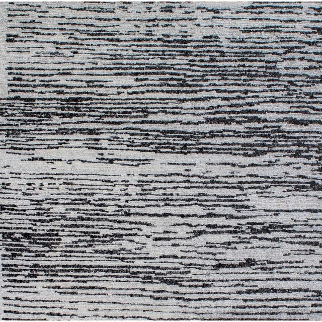 Beautiful hand knotted modern and fashionable collection of borderless designs rug, made of 75% wool and 25% cotton in...