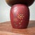 A refined, creative kokeshi with a beautiful balance of dark and warm-toned wood. The face is rendered in a minimal style,...