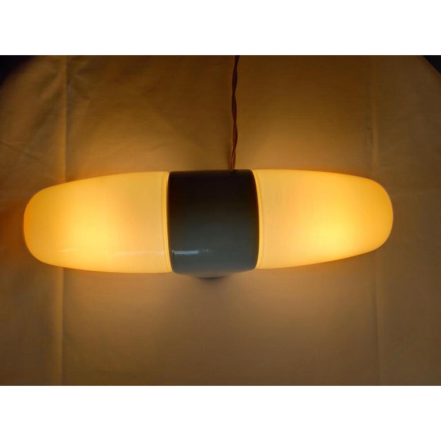 Xxl wilhelm wagenfeld mirror or wall lamp equipped with 2x e27 sockets and dating from the 1950s. The wall lamp is in mint...