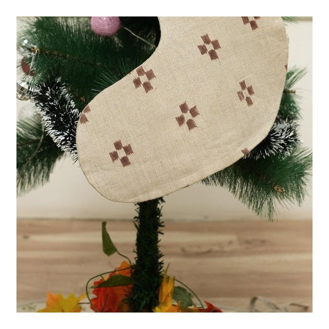 Add festive charm to your home with this handmade block print stocking, crafted from a premium linen-blend fabric and...