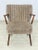 Two stylish vintage armchairs from the 1960s. These armchairs impress with their classic design, featuring upholstered...