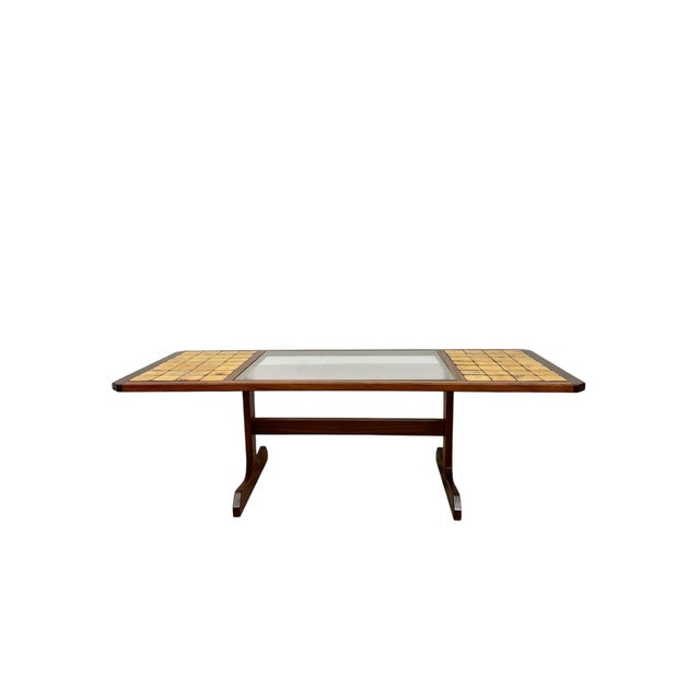 This vintage mid-century modern coffee table features a distinctive mixed-surface top composed of two inset tile panels at...